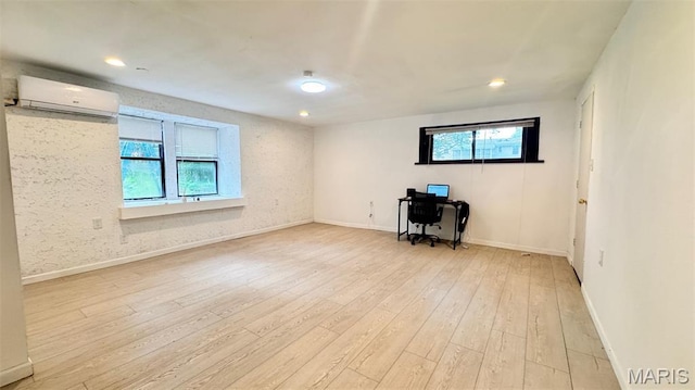 3400 Adie Rd, Saint Ann, MO 63074 - empty room with a wall mounted air conditioner, light wood finished floors, an office area, and recessed lighting