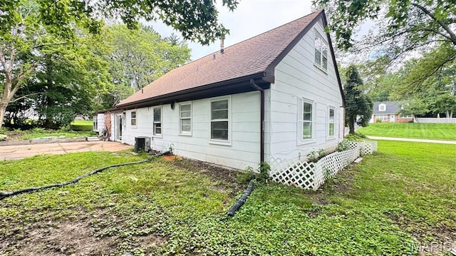 3400 Adie Rd, Saint Ann, MO 63074 - view of side of property with a shingled roof, a yard, and a patio area