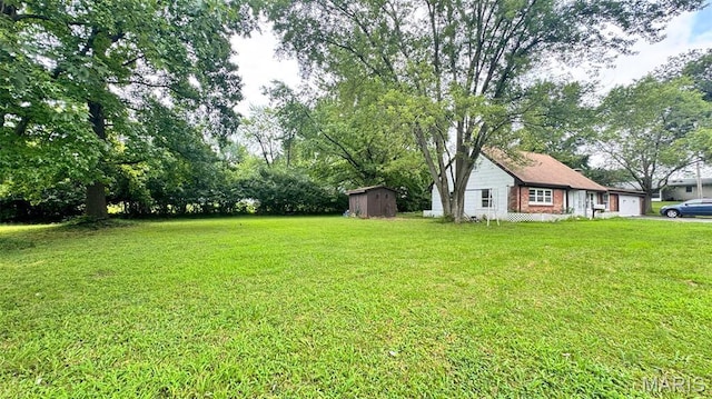 3400 Adie Rd, Saint Ann, MO 63074 - view of grassy yard featuring a storage shed