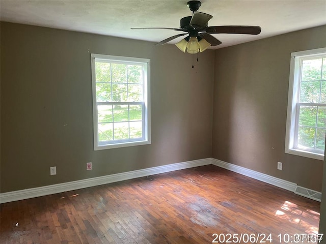 514 O Dell Ave, Richland, MO 65556 - empty room featuring plenty of natural light, wood-type flooring, and ceiling fan