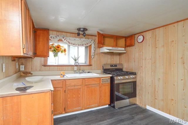 601 Mcbride Ave, Dupo, IL 62239 - kitchen with gas range, light countertops, wood walls, dark wood-style flooring, and ventilation hood