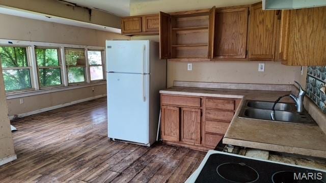 628 N Division St, Bonne Terre, MO 63628 - kitchen featuring open shelves, freestanding refrigerator, brown cabinetry, dark wood finished floors, and light countertops