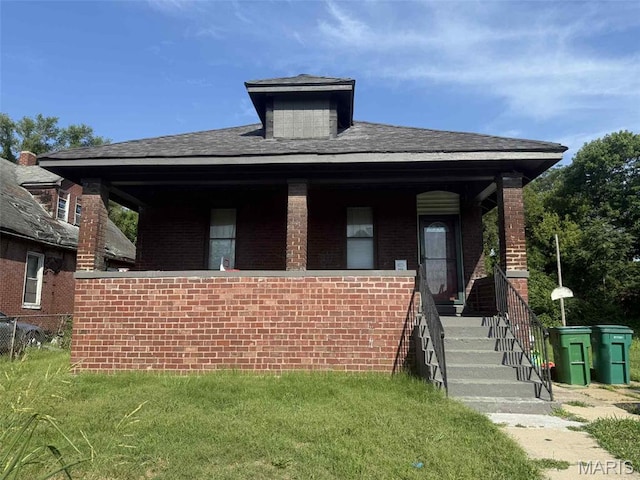 711 N 33rd St E, St Louis, IL 62205 - view of front facade featuring brick siding, stairway, a porch, and roof with shingles