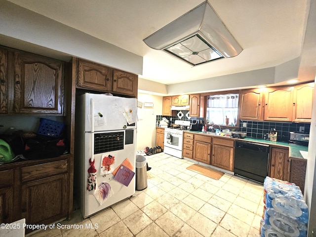 kitchen featuring backsplash and white appliances