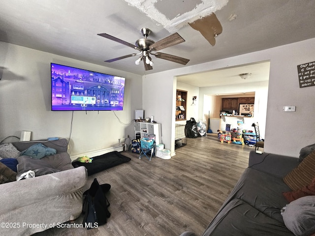 living room featuring hardwood / wood-style flooring and ceiling fan