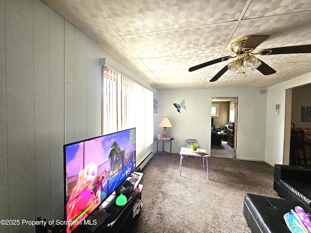 living room with ceiling fan, baseboard heating, and carpet