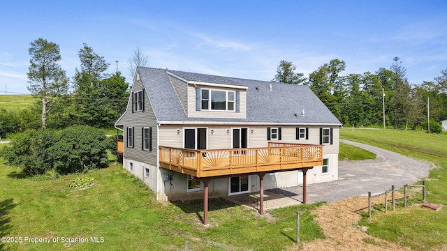 20337 State Route 171, Susquehanna, PA 18847 - rear view of house featuring a wooden deck, a lawn, a patio area, and a shingled roof