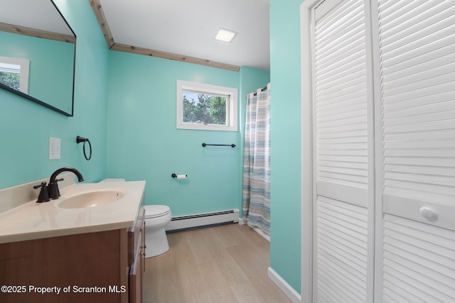 20337 State Route 171, Susquehanna, PA 18847 - bathroom featuring baseboard heating, wood finished floors, vanity, and healthy amount of natural light