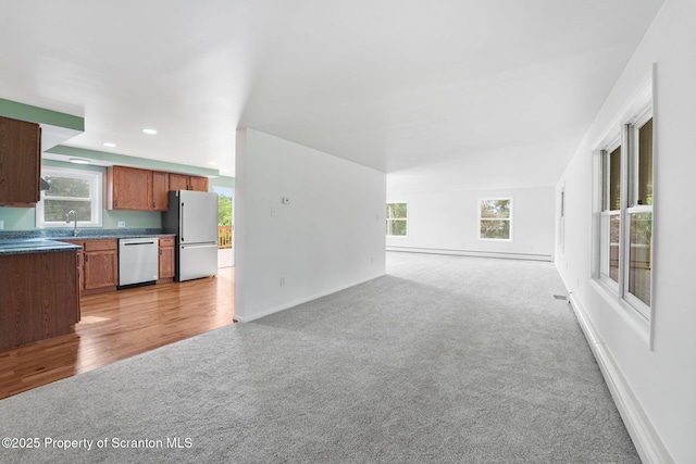 20337 State Route 171, Susquehanna, PA 18847 - unfurnished living room with light colored carpet, recessed lighting, and a baseboard heating unit