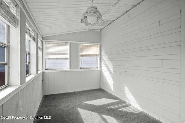 unfurnished sunroom with lofted ceiling