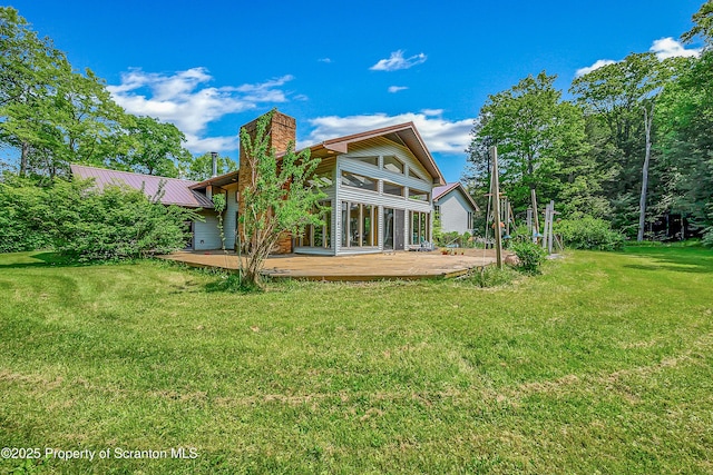 1742 State Route 848, New Milford, PA 18834 - rear view of property with a chimney, a deck, a yard, and a metal roof