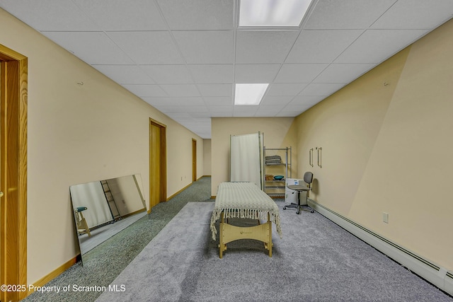 1742 State Route 848, New Milford, PA 18834 - living area with carpet, a drop ceiling, and a baseboard heating unit
