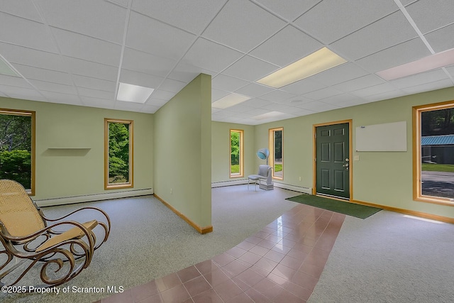 1742 State Route 848, New Milford, PA 18834 - unfurnished room with carpet flooring, baseboard heating, plenty of natural light, a drop ceiling, and tile patterned flooring