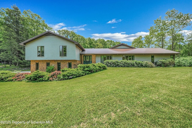 1742 State Route 848, New Milford, PA 18834 - tri-level home featuring brick siding, a front lawn, and a metal roof