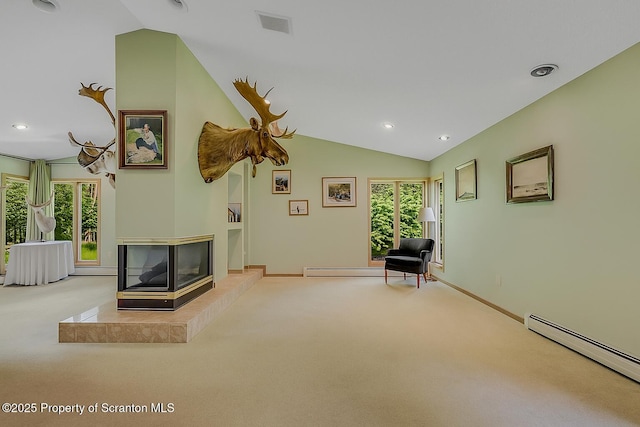 1742 State Route 848, New Milford, PA 18834 - living area featuring a baseboard heating unit, carpet floors, lofted ceiling, recessed lighting, and a fireplace