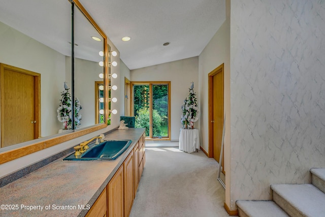 1742 State Route 848, New Milford, PA 18834 - bathroom with lofted ceiling, vanity, and recessed lighting