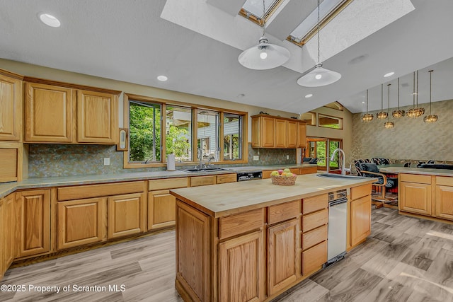 1742 State Route 848, New Milford, PA 18834 - kitchen with a skylight, a kitchen island with sink, butcher block countertops, pendant lighting, and decorative backsplash