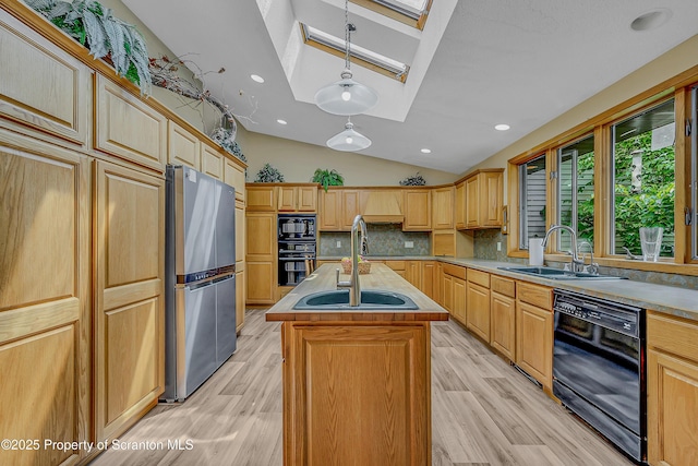 1742 State Route 848, New Milford, PA 18834 - kitchen with black appliances, a skylight, a center island with sink, light wood-type flooring, and vaulted ceiling