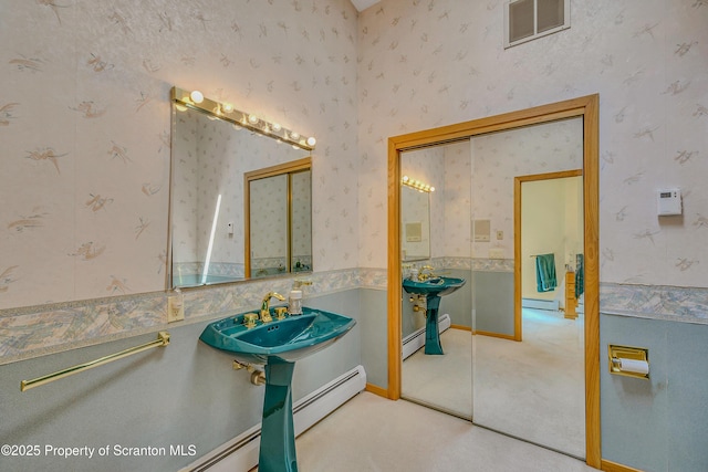 1742 State Route 848, New Milford, PA 18834 - bathroom with wallpapered walls, a baseboard heating unit, and a baseboard radiator