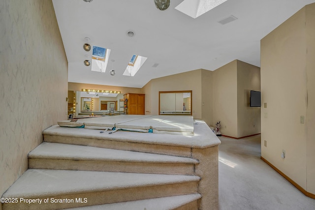 1742 State Route 848, New Milford, PA 18834 - stairway featuring a skylight, carpet floors, and lofted ceiling
