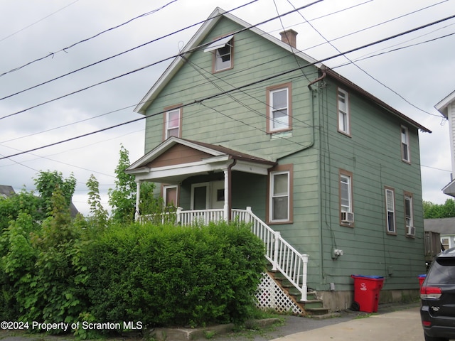 view of front property featuring a porch