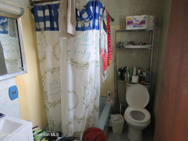 bathroom with shower / bath combo and toilet