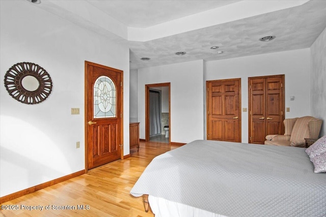 bedroom with hardwood / wood-style flooring