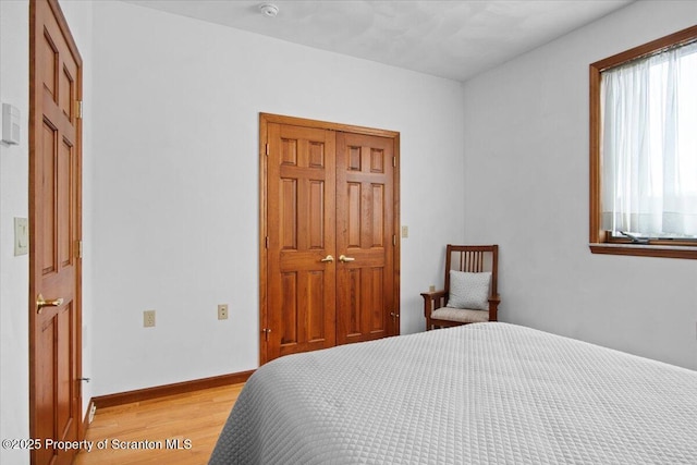 bedroom with light wood-type flooring