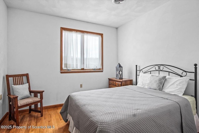 bedroom featuring hardwood / wood-style floors