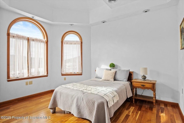 bedroom featuring wood-type flooring