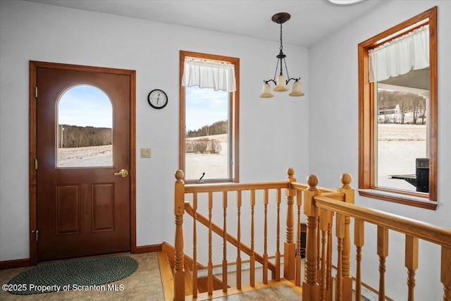 foyer featuring an inviting chandelier