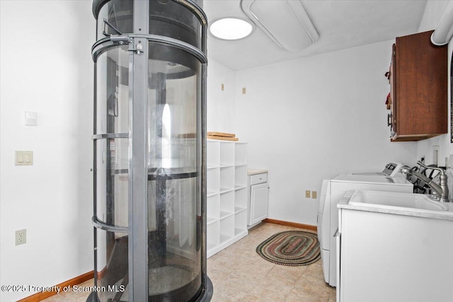 laundry area featuring cabinets and separate washer and dryer