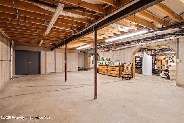 basement featuring water heater