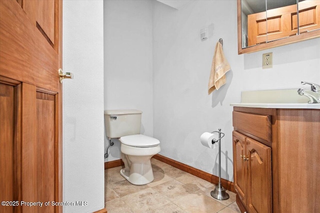 bathroom with vanity, tile patterned flooring, and toilet