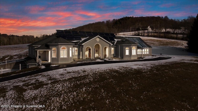 view of front of house with solar panels