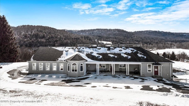 view of front of property with a mountain view