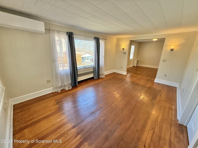 empty room featuring crown molding and light hardwood / wood-style floors