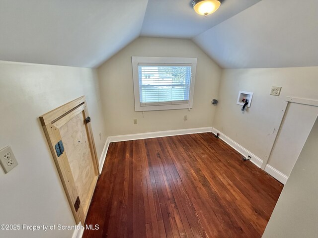 kitchen featuring light wood-type flooring, radiator, backsplash, and stainless steel fridge