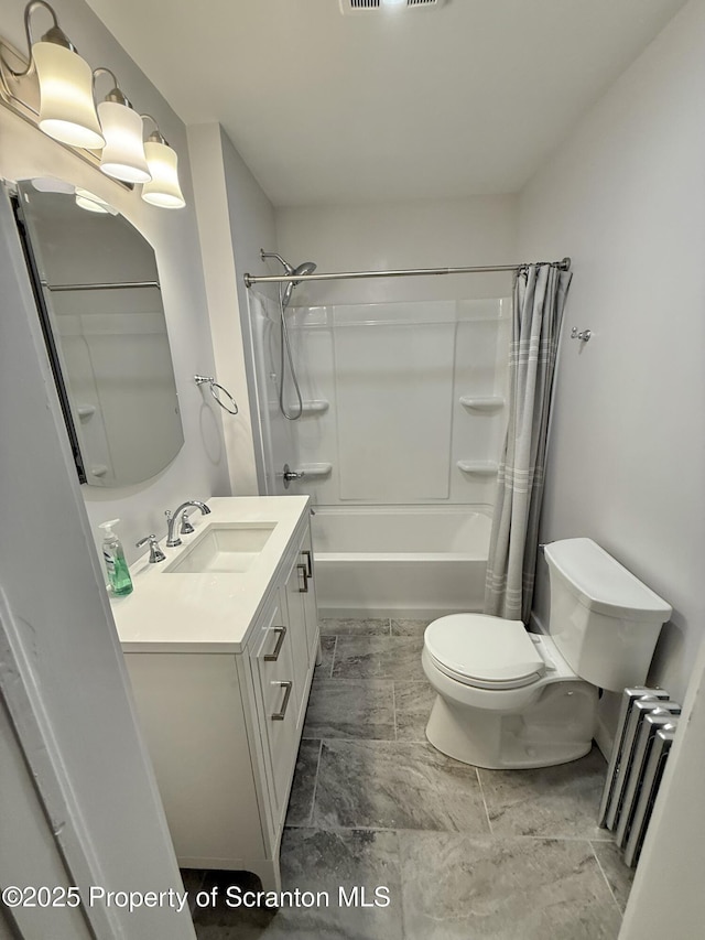 full bathroom with toilet, vanity, and shower / tub combo