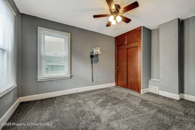 unfurnished bedroom with visible vents, baseboards, a closet, and carpet floors