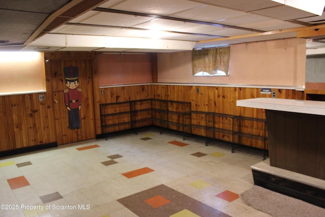 205 Orchard St, Old Forge, PA 18518 - finished below grade area featuring tile patterned floors, wood walls, and wainscoting