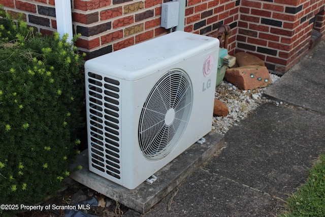 205 Orchard St, Old Forge, PA 18518 - exterior view of an ac unit and brick siding