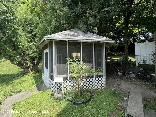 view of outdoor structure with a lawn