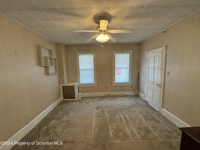 spare room featuring carpet floors and ceiling fan