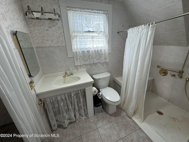 bathroom with tile patterned floors, vanity, vaulted ceiling, toilet, and curtained shower