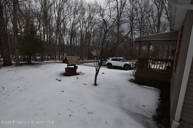 view of yard covered in snow