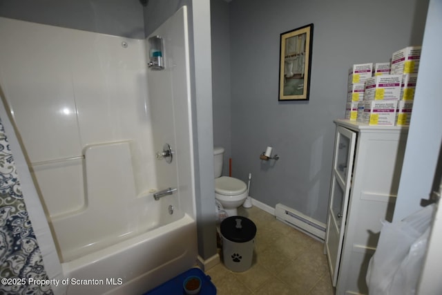 bathroom featuring baseboard heating, shower / bath combo, toilet, and baseboards