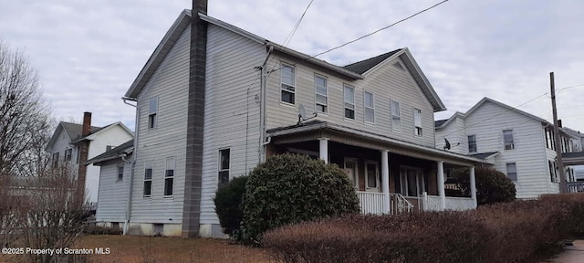 view of home's exterior with covered porch