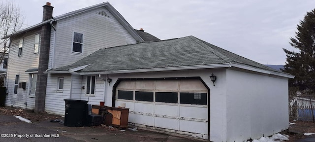 view of side of property featuring a garage