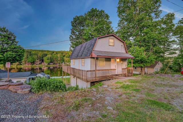 482 Lakeview Dr, Kingsley, PA 18826 - dutch colonial with a gambrel roof, roof with shingles, a view of trees, a water view, and a porch